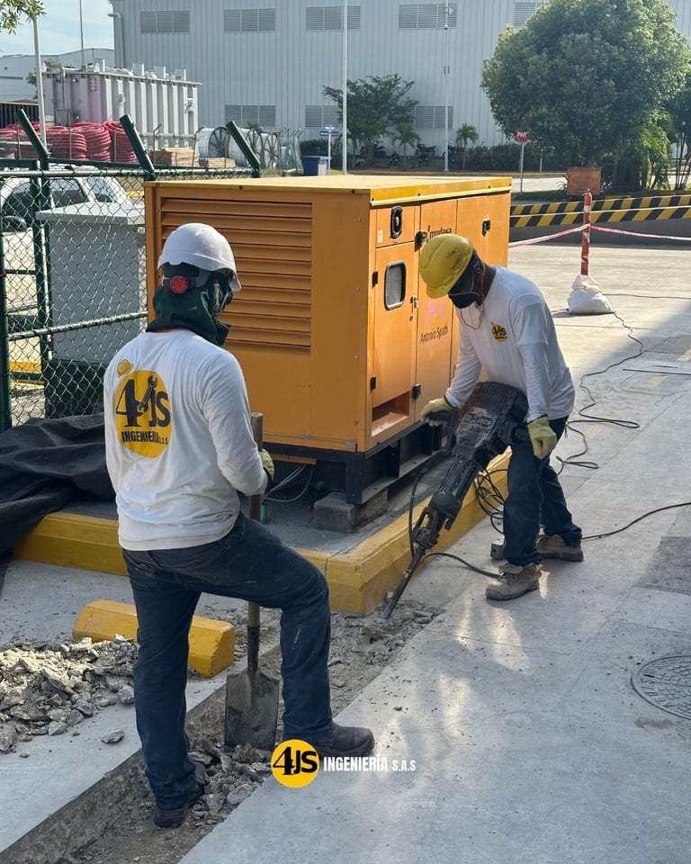 Two workers in safety gear inspecting a yellow industrial generator at a construction site